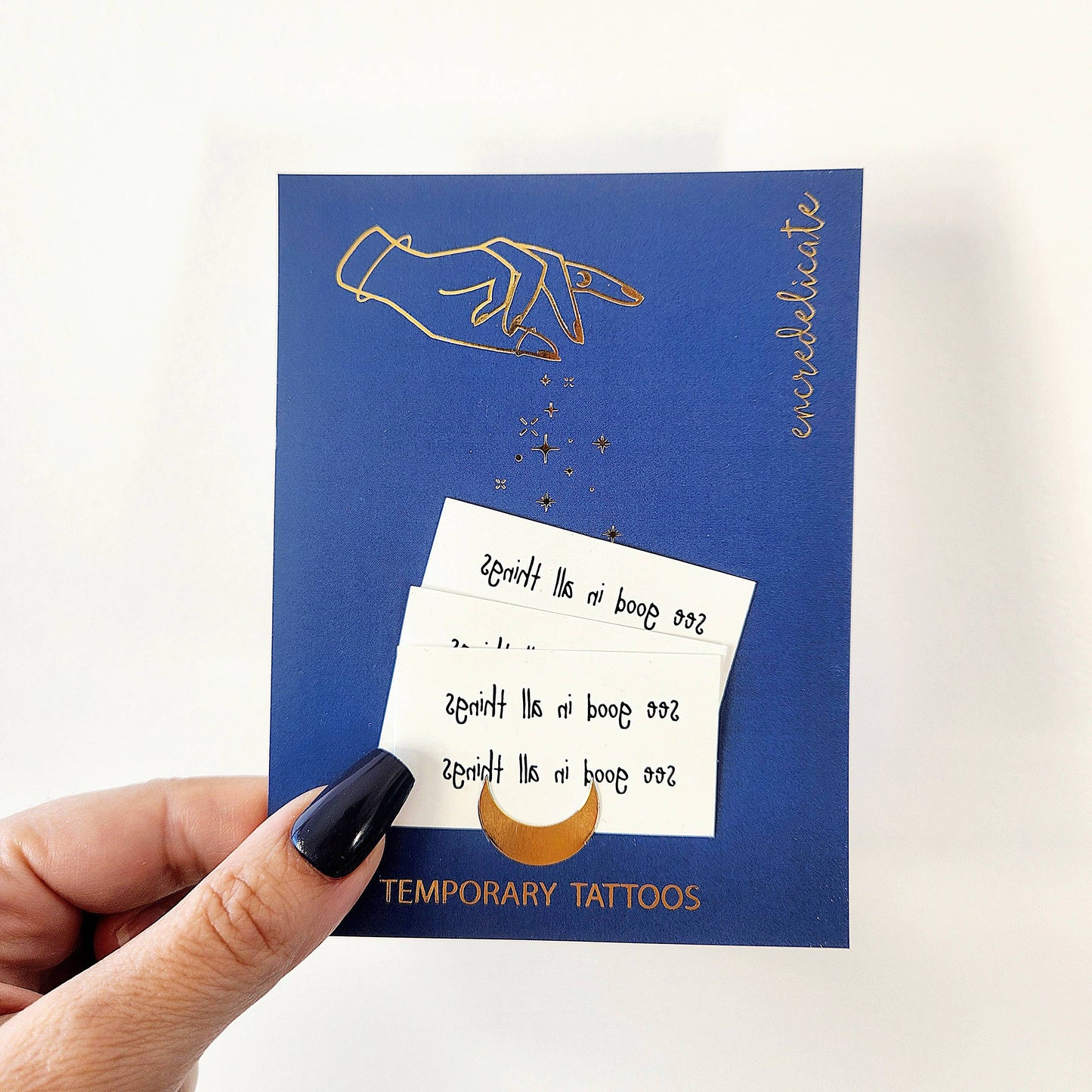 Temporary tattoo of the phrase "see good in all things"