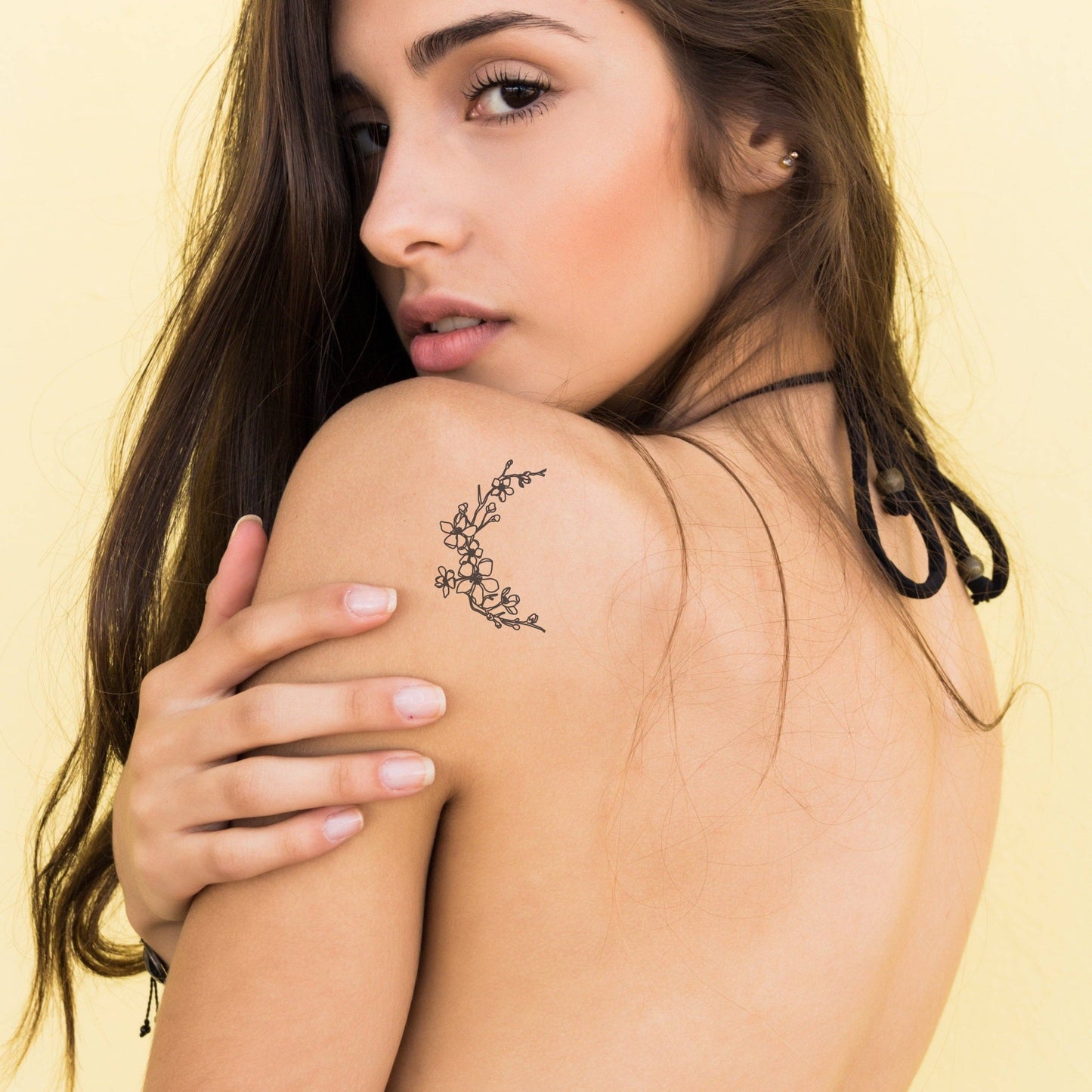 Temporary moon tattoo with flowers